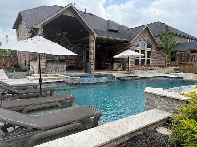 34315 E Short Leaf Pine Ct, Pinehurst, TX 77362 - view of swimming pool with a pool with connected hot tub, a patio, fence, and outdoor dry bar