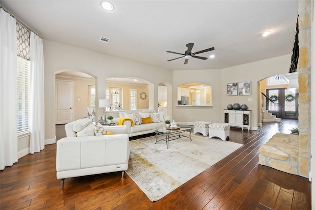 21207 Fairhaven Creek Dr, Cypress, TX 77433 - living area featuring plenty of natural light, ceiling fan, arched walkways, visible vents, and dark wood-style floors