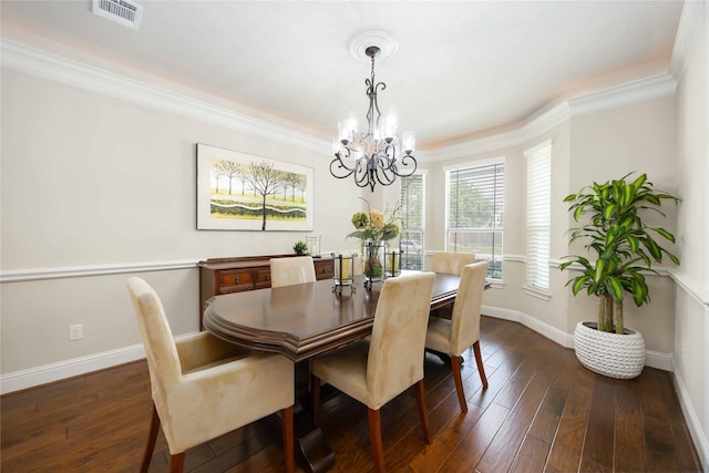 21207 Fairhaven Creek Dr, Cypress, TX 77433 - dining space with dark wood-style flooring, baseboards, visible vents, an inviting chandelier, and ornamental molding