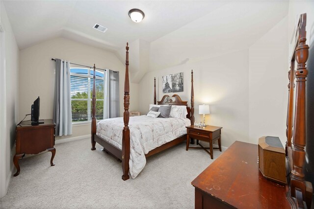 21207 Fairhaven Creek Dr, Cypress, TX 77433 - bedroom featuring baseboards, lofted ceiling, visible vents, and light carpet