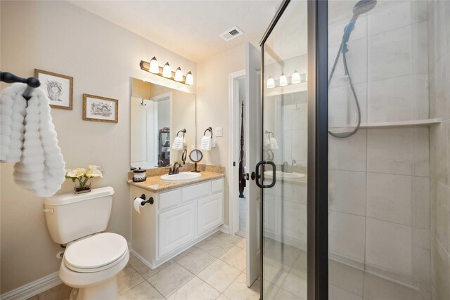 21207 Fairhaven Creek Dr, Cypress, TX 77433 - full bathroom with toilet, a stall shower, vanity, baseboards, and visible vents