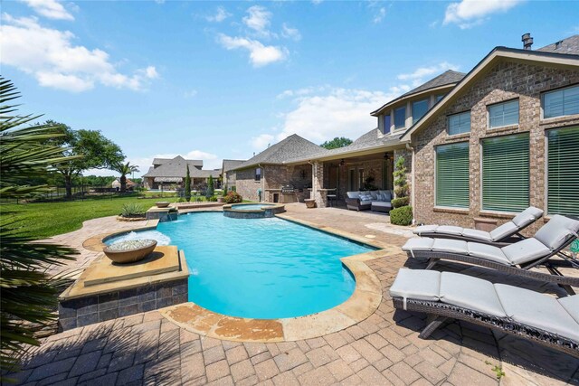 21207 Fairhaven Creek Dr, Cypress, TX 77433 - view of swimming pool featuring outdoor lounge area, a yard, a pool with connected hot tub, and a patio