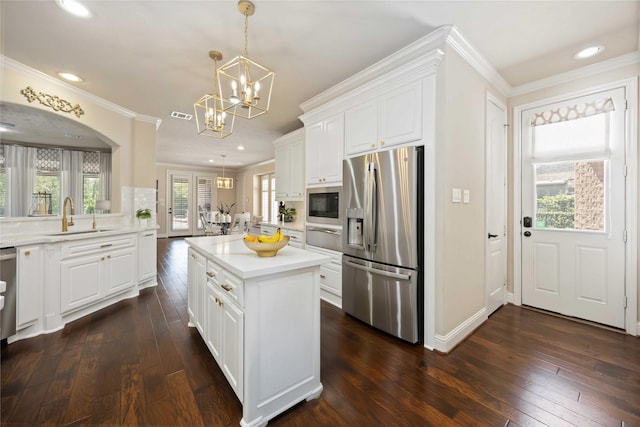 21207 Fairhaven Creek Dr, Cypress, TX 77433 - kitchen with an inviting chandelier, stainless steel fridge with ice dispenser, ornamental molding, a sink, and a warming drawer