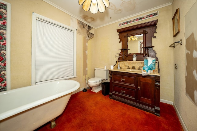 full bathroom with a freestanding tub, toilet, vanity, baseboards, and crown molding