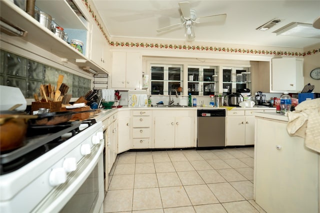 kitchen featuring white cabinets, a sink, light countertops, dishwasher, and white gas stove