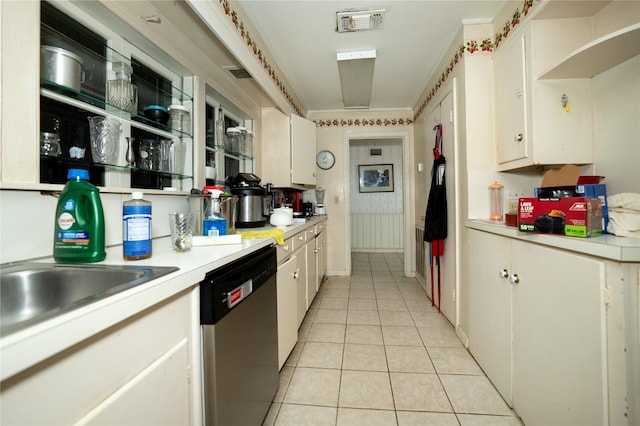 kitchen with light tile patterned floors, visible vents, light countertops, dishwasher, and white cabinets