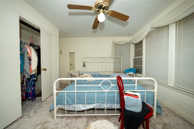 bedroom with a closet, ceiling fan, and carpet