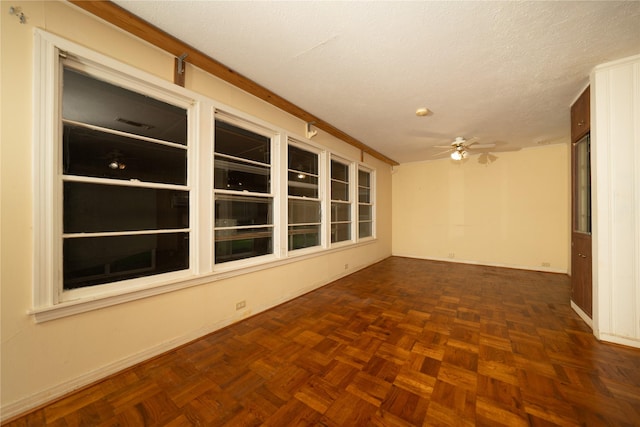 404 N Grace St, Crockett, TX 75835 - empty room with a ceiling fan and a textured ceiling