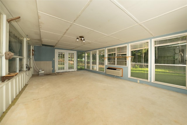 404 N Grace St, Crockett, TX 75835 - unfurnished sunroom with french doors and an AC wall unit