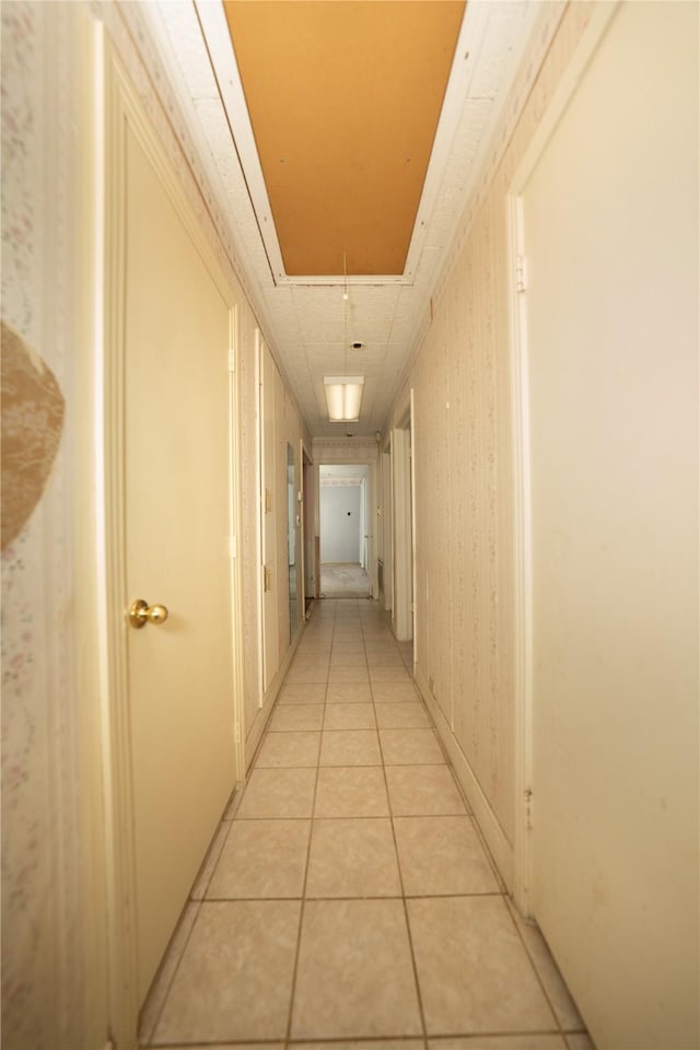 404 N Grace St, Crockett, TX 75835 - corridor featuring attic access and light tile patterned floors