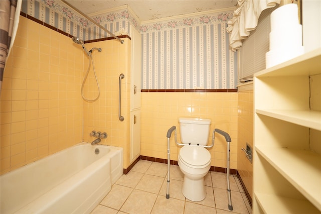 404 N Grace St, Crockett, TX 75835 - bathroom featuring wallpapered walls, shower / bath combo, wainscoting, tile patterned flooring, and tile walls