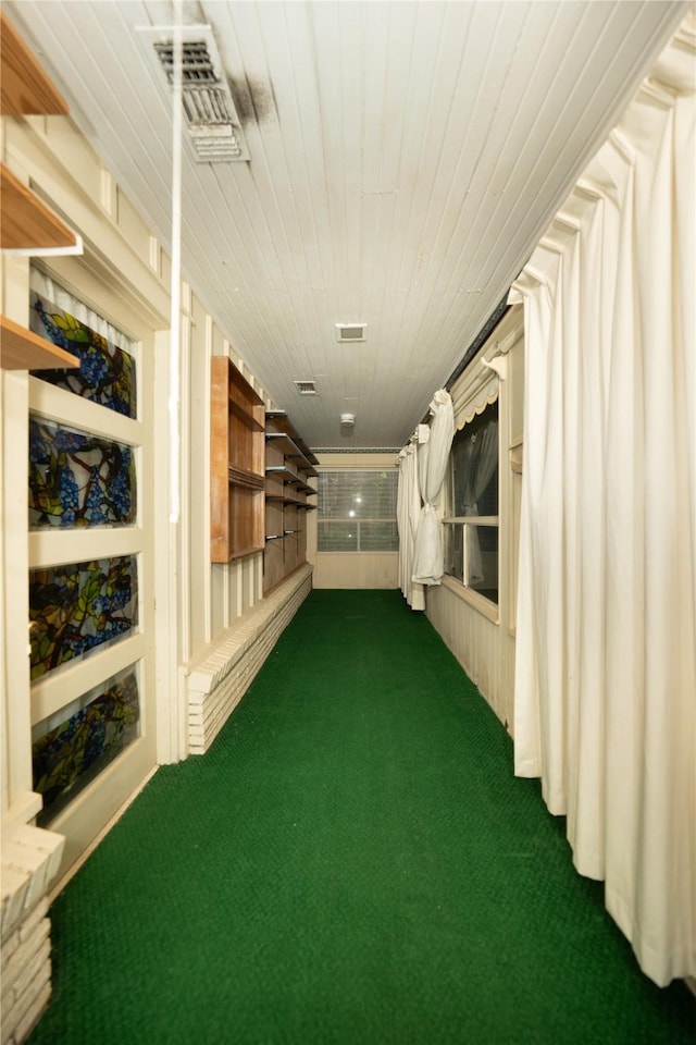 404 N Grace St, Crockett, TX 75835 - hallway featuring dark colored carpet and wood ceiling