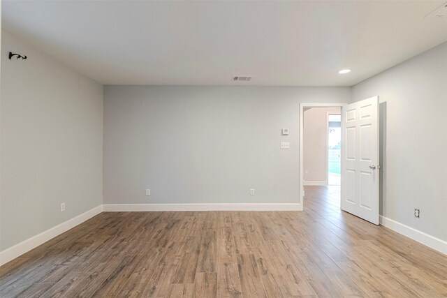 1189 Fm 935, Lott, TX 76656 - empty room with wood finished floors, baseboards, visible vents, and recessed lighting