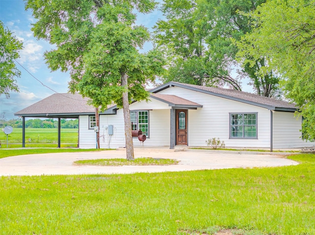 1189 Fm 935, Lott, TX 76656 - ranch-style home with an attached carport, a front yard, and driveway