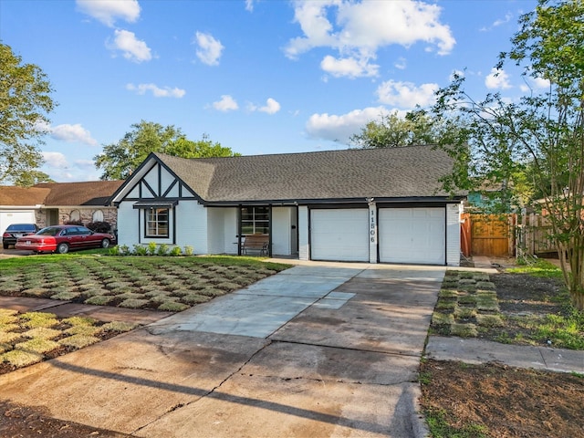 11506 Kirkhollow Dr, Houston, TX 77089 - view of front of home featuring an attached garage, fence, concrete driveway, and brick siding