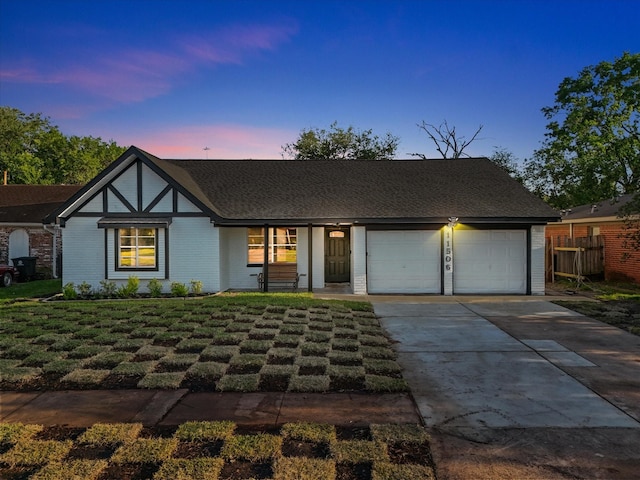 11506 Kirkhollow Dr, Houston, TX 77089 - view of front facade with a garage, driveway, and brick siding
