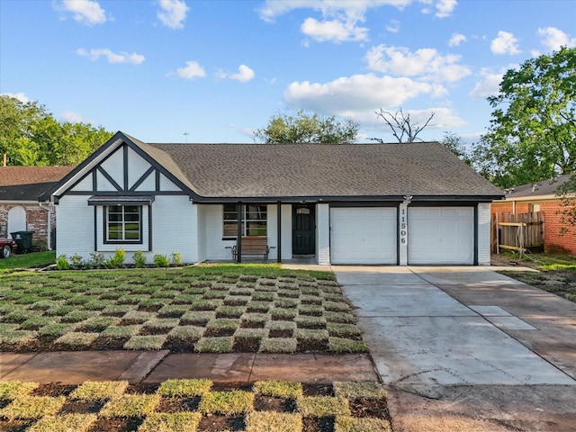 11506 Kirkhollow Dr, Houston, TX 77089 - view of front of house with an attached garage, concrete driveway, and brick siding