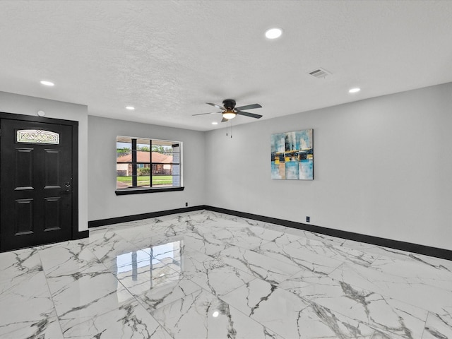 11506 Kirkhollow Dr, Houston, TX 77089 - foyer entrance with recessed lighting, baseboards, a ceiling fan, light marble finish flooring, and a textured ceiling