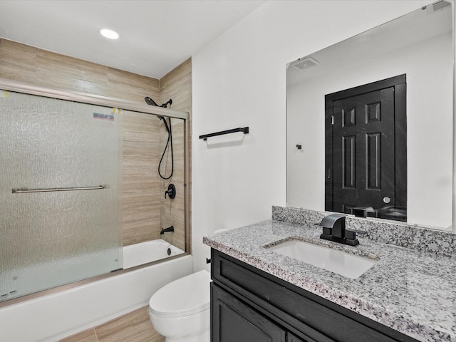 11506 Kirkhollow Dr, Houston, TX 77089 - bathroom featuring toilet, shower / bath combination with glass door, and vanity