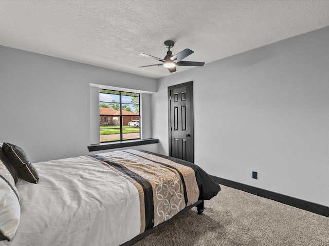 11506 Kirkhollow Dr, Houston, TX 77089 - carpeted bedroom with baseboards, a ceiling fan, and a textured ceiling