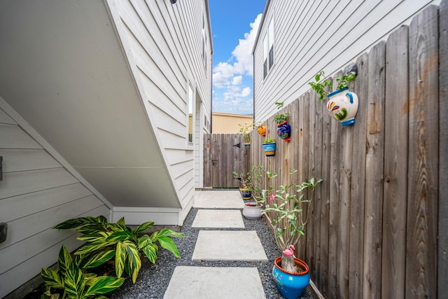 view of home's exterior with fence
