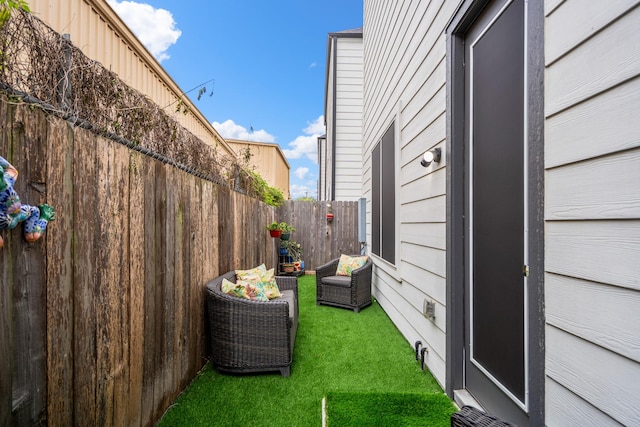 view of home's exterior with a yard and fence