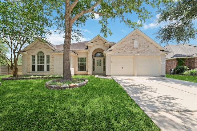 8122 Dune Brook Dr, Pearland, TX 77089 - view of front facade featuring an attached garage, a front lawn, concrete driveway, and brick siding