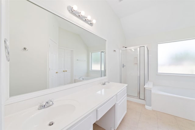 8122 Dune Brook Dr, Pearland, TX 77089 - bathroom with lofted ceiling, a garden tub, a shower stall, and tile patterned flooring