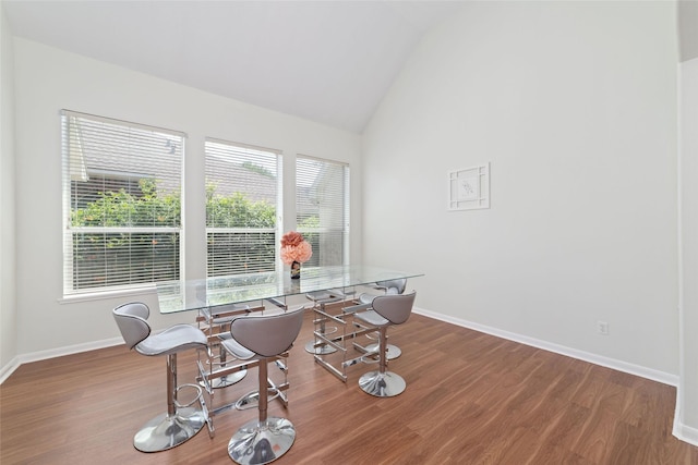 8122 Dune Brook Dr, Pearland, TX 77089 - dining space featuring vaulted ceiling, wood finished floors, and baseboards