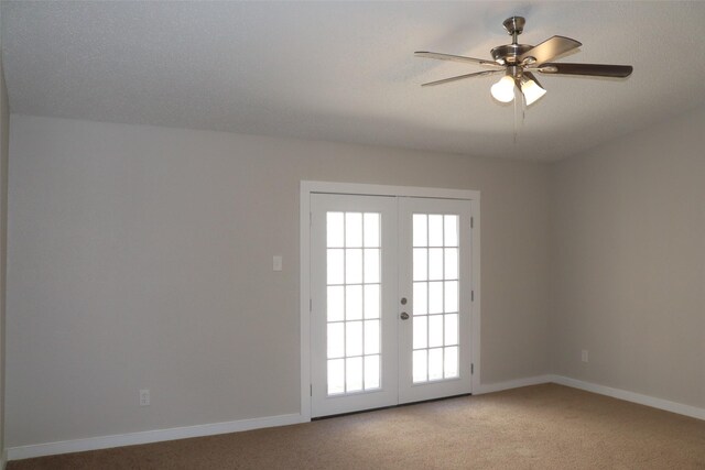 unfurnished room featuring light carpet, baseboards, a ceiling fan, and plenty of natural light