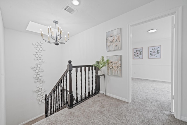 4731 N Cashel Cir, Houston, TX 77069 - staircase featuring visible vents, baseboards, a notable chandelier, carpet, and a skylight