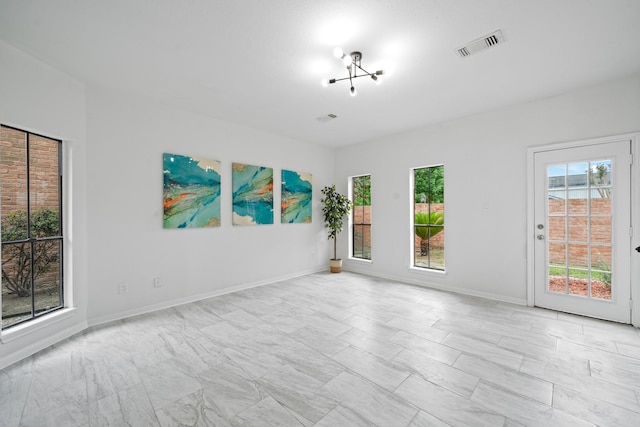 4731 N Cashel Cir, Houston, TX 77069 - spare room with a healthy amount of sunlight, marble finish floor, baseboards, and visible vents