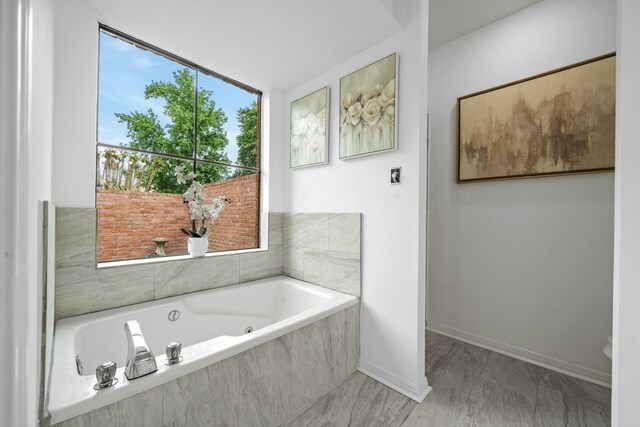 4731 N Cashel Cir, Houston, TX 77069 - full bathroom with marble finish floor, a bath, and baseboards