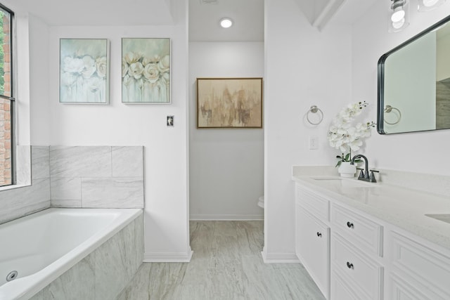 4731 N Cashel Cir, Houston, TX 77069 - full bathroom featuring a garden tub, toilet, a sink, double vanity, and baseboards