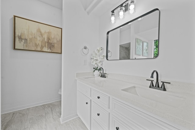4731 N Cashel Cir, Houston, TX 77069 - full bath with double vanity, marble finish floor, a sink, and baseboards