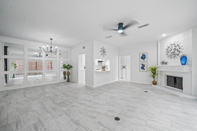 4731 N Cashel Cir, Houston, TX 77069 - unfurnished living room featuring crown molding, ceiling fan with notable chandelier, a brick fireplace, and visible vents