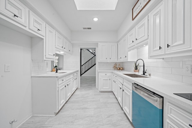 4731 N Cashel Cir, Houston, TX 77069 - kitchen with dishwasher, visible vents, a sink, and white cabinetry
