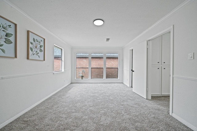 4731 N Cashel Cir, Houston, TX 77069 - carpeted spare room featuring ornamental molding, baseboards, and a textured ceiling