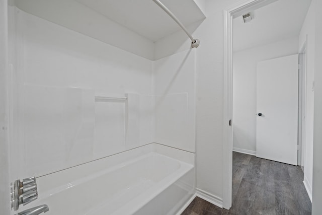 4731 N Cashel Cir, Houston, TX 77069 - bathroom featuring visible vents, washtub / shower combination, baseboards, and wood finished floors