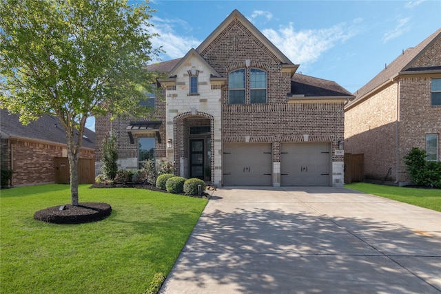 2736 Ahnya Ln, League City, TX 77573 - french country inspired facade featuring brick siding, an attached garage, concrete driveway, and a front yard