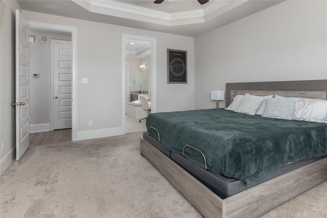 2736 Ahnya Ln, League City, TX 77573 - bedroom featuring a raised ceiling, carpet, crown molding, baseboards, and connected bathroom
