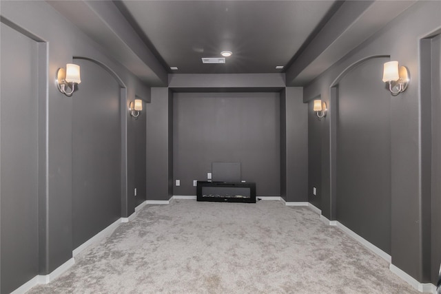 2736 Ahnya Ln, League City, TX 77573 - carpeted home theater room with arched walkways and baseboards