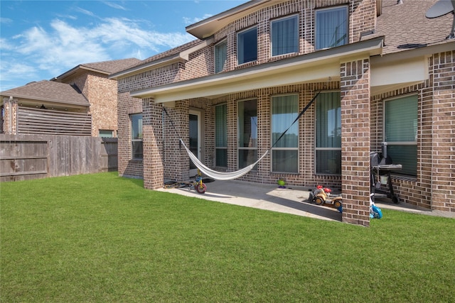 2736 Ahnya Ln, League City, TX 77573 - back of property featuring brick siding, a patio area, and a shingled roof