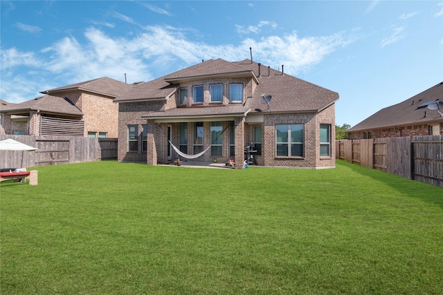 2736 Ahnya Ln, League City, TX 77573 - back of property featuring roof with shingles and brick siding