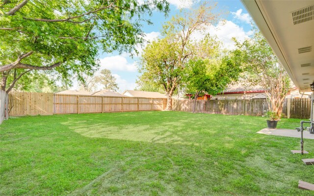 view of yard with a fenced backyard