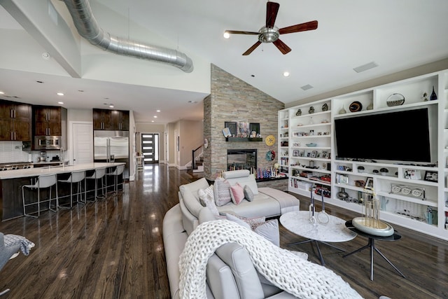 living area with a fireplace, recessed lighting, dark wood finished floors, ceiling fan, and high vaulted ceiling