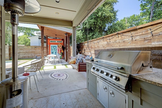 view of patio with grilling area, area for grilling, and fence private yard