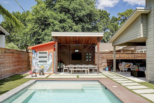 view of swimming pool featuring fence, a fenced in pool, and a patio