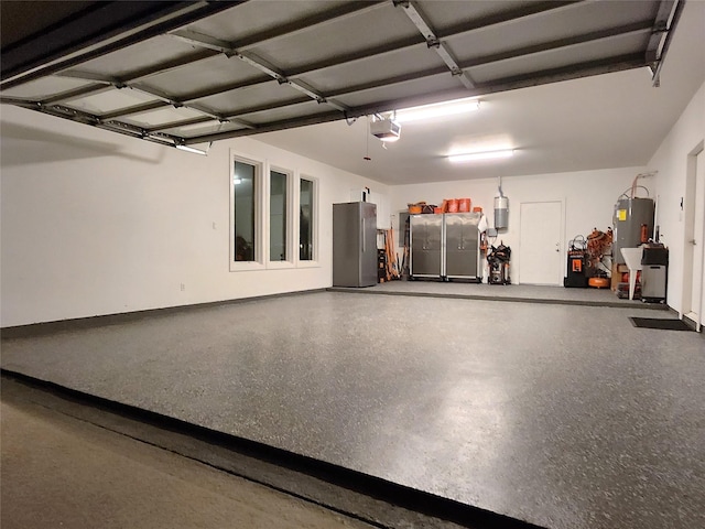 38 Fairway Park, Montgomery, TX 77356 - garage featuring a garage door opener and water heater