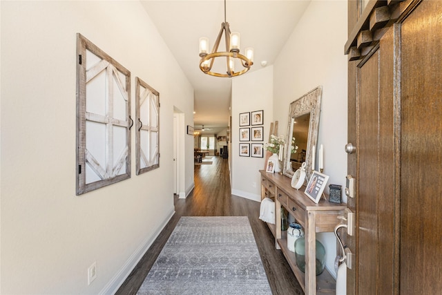 21718 Rose Maris Ln, Tomball, TX 77377 - corridor with baseboards, an inviting chandelier, and dark wood finished floors